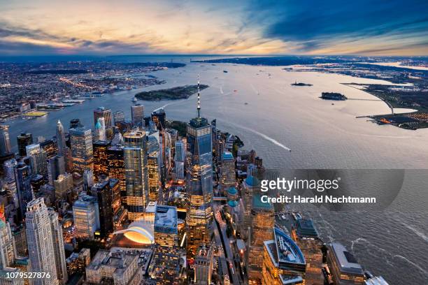 aerial view of manhattan island and harbor at dusk, new york city, new york state, united states - new york world trade center stockfoto's en -beelden