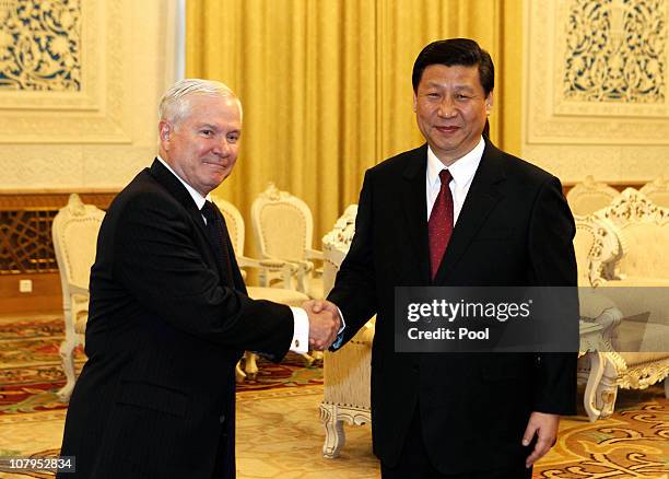 Secretary of Defense Robert Gates shakes hands with China's Vice President Xi Jinping at the Great Hall of the People on January 10, 2011 in Beijing,...