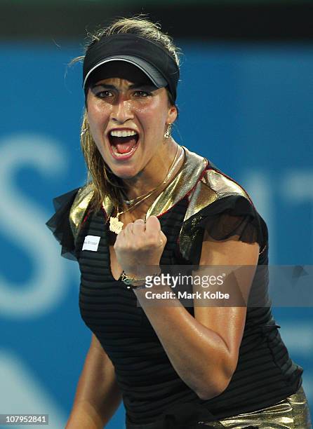 Aravane Rezai of France celebrates winning a point in match against Jelena Jankovic of Serbia during day two of the 2011 Medibank International at...