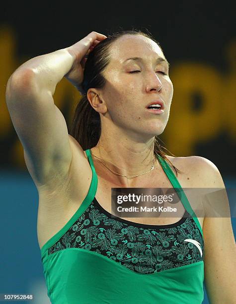 Jelena Jankovic of Serbia reacts after losing a point in her match against Aravane Rezai of France during day two of the 2011 Medibank International...