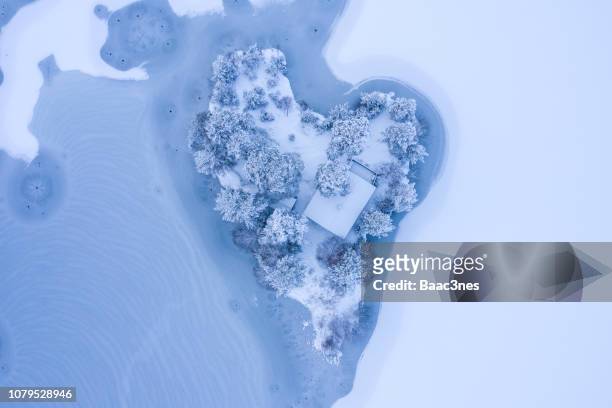 heart-shaped island with a smal cabin - cabin norway stock pictures, royalty-free photos & images