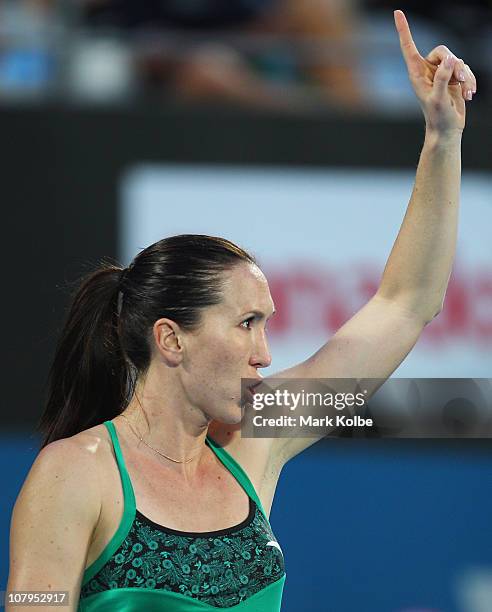 Jelena Jankovic of Serbia calls for a review after losing a point in her match against Aravane Rezai of France during day two of the 2011 Medibank...