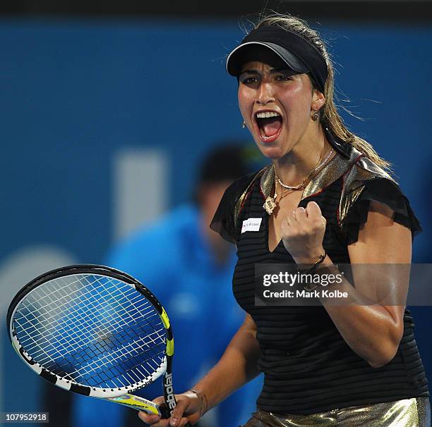 Aravane Rezai of France celebrates winning a point in match against Jelena Jankovic of Serbia during day two of the 2011 Medibank International at...