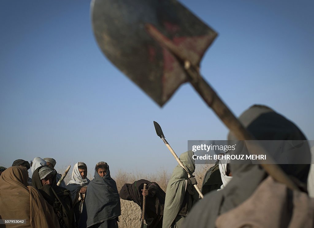 Afghan villagers, hired by the US Army t