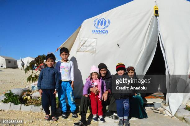 Syrian kids pose for a photo at a tent camp, built by Prime Minister's Disaster and Emergency Management in Suruc district of Sanliurfa, Turkey on...