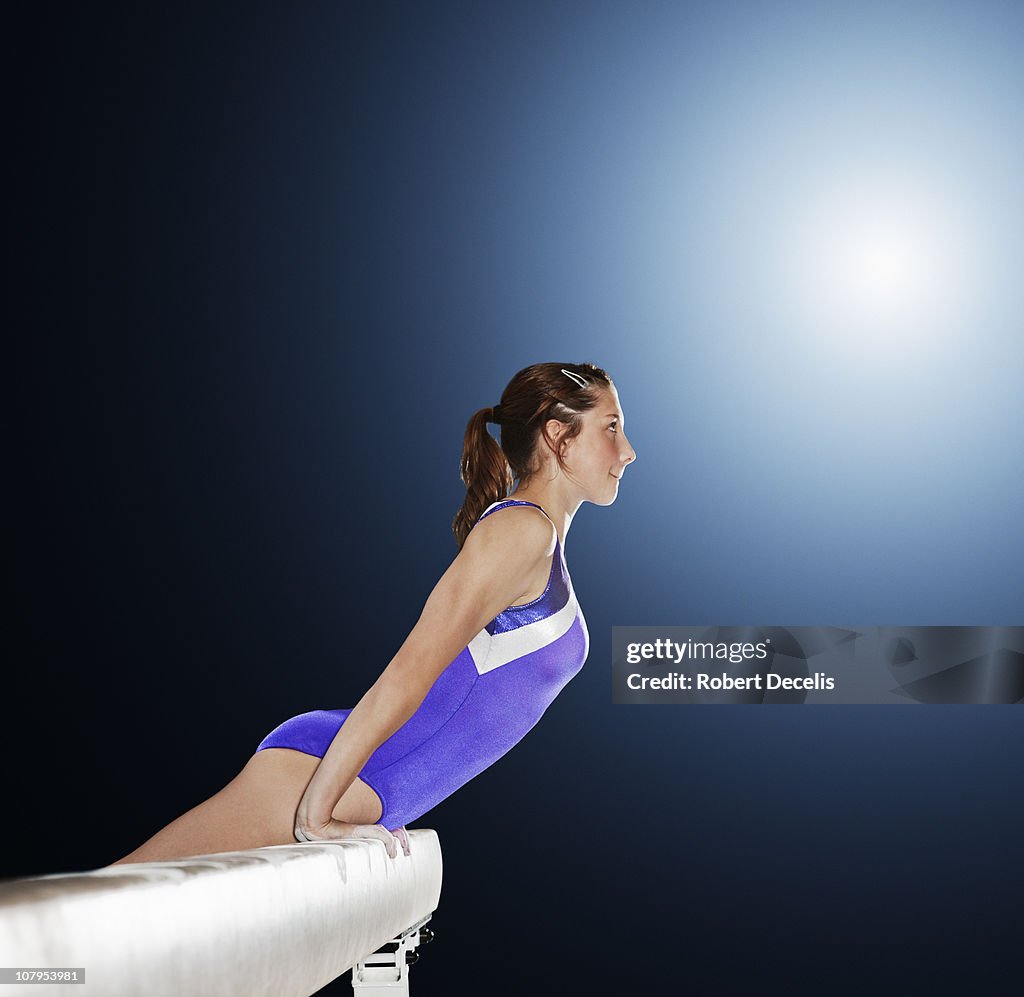 Gymnast mounting balance beam