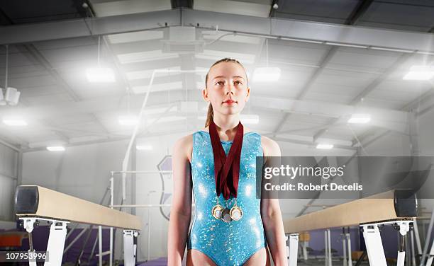 young gymnast with medals - acrobat stock pictures, royalty-free photos & images