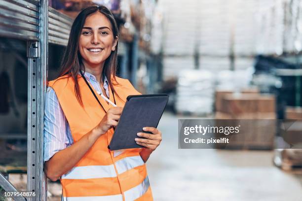 warehouse manager with digital tablet - warehouse safety stock pictures, royalty-free photos & images