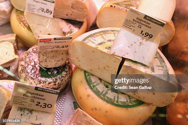 Organic cheese varieties lie in a refrigerator display at a branch of German organic grocery store chain Bio Company on January 10, 2011 in Berlin,...