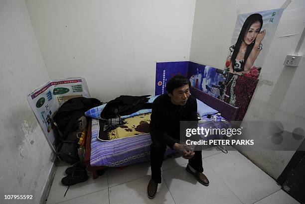 Lifestyle-China-property-inflation-social,FEATURE by Dan MartinThis photo taken on January 5, 2011 shows 47-year-old Chinese migrant worker Shen...