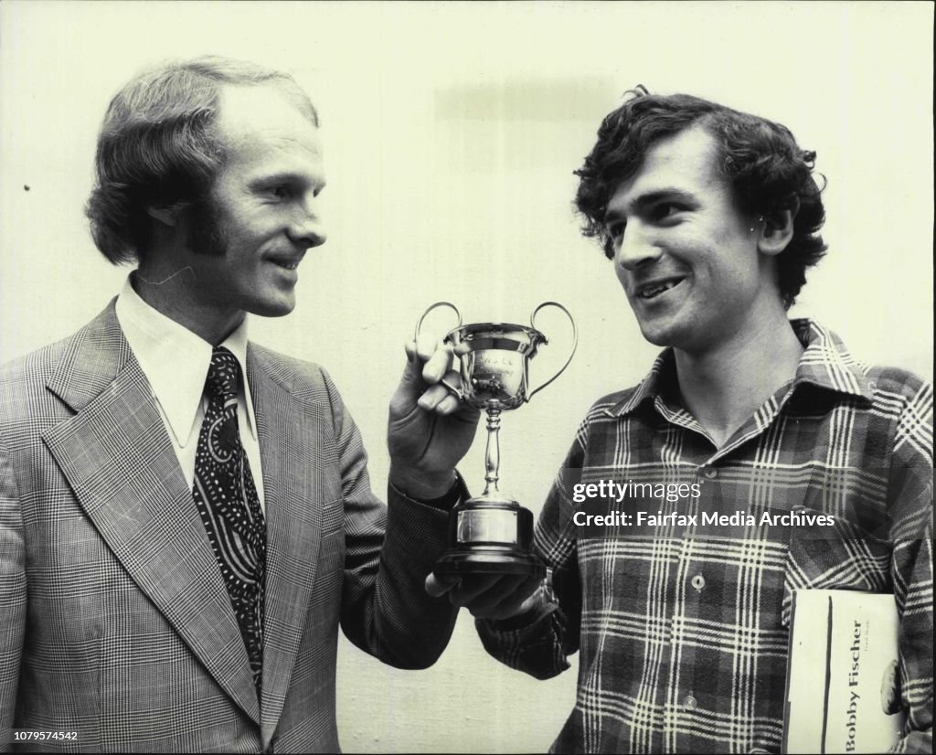 Junior Chess Champion of NSW Michael Mescher (17) of Homebush. Receives his trophy from Mr. Colin Longton, Personal Manager of Farmer's City Store.The Junior NSW State Chess Champion was named today at the close of the tournament which has been held at Fa