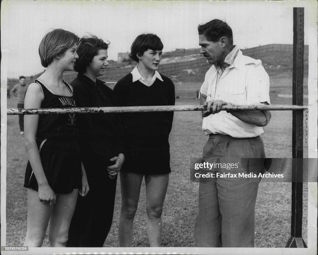 Former Australian Olympic representative Jack Metcalfe talks to junior high jumpers l to r. Elizabeth MacKenzie, 15, of Manly, Janice Jones, 15, Northern Suburbs, and ***** Cooper, 15, of Gosford.