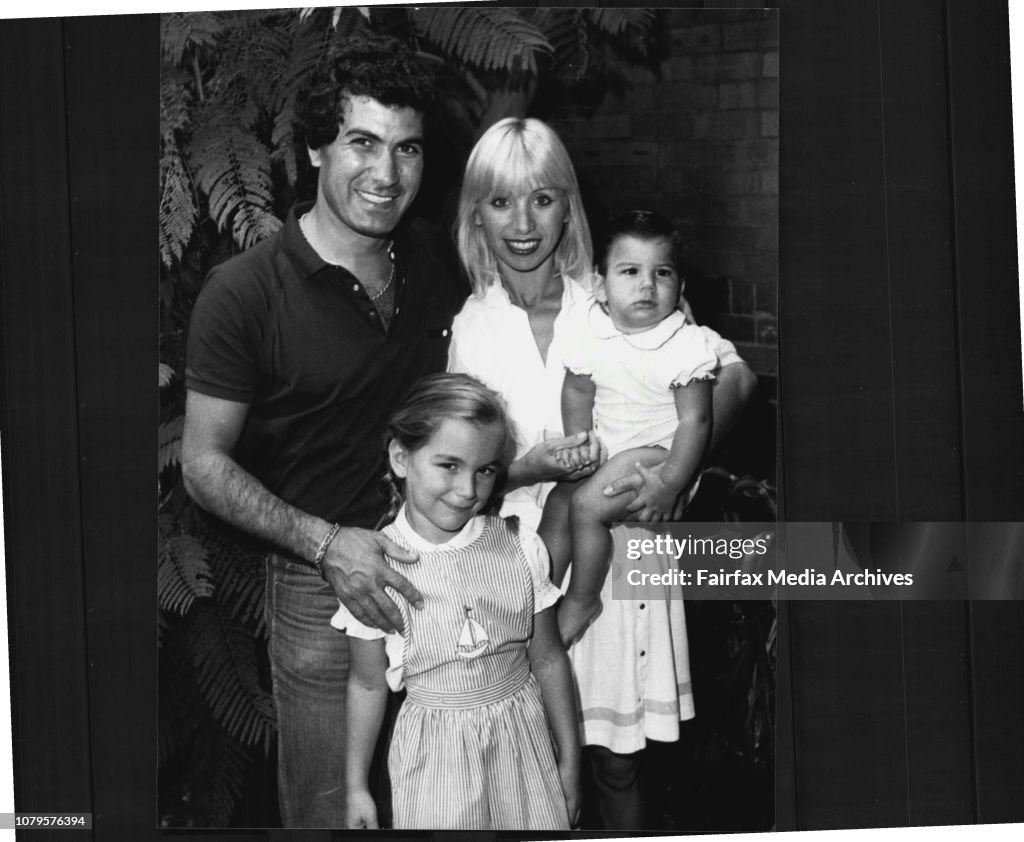 Mr. Harry Michaels and wife Effie, daughter Natalie, 6 and baby son Michael, 13 months at his place at glebe.