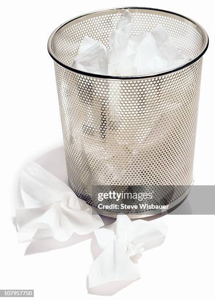 a wastepaper basket full of used tissues - wastepaper basket stock pictures, royalty-free photos & images