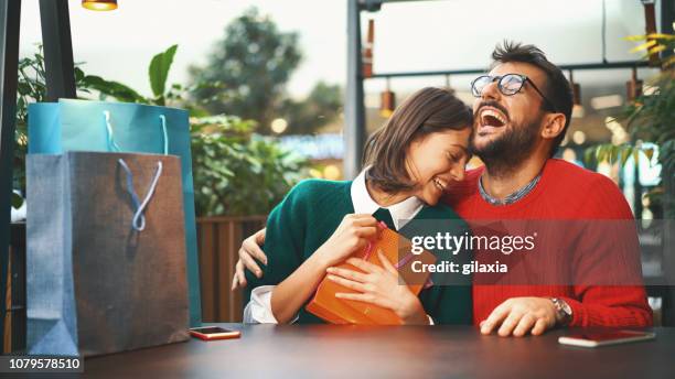merry christmas my love. - exchanging gifts stock pictures, royalty-free photos & images
