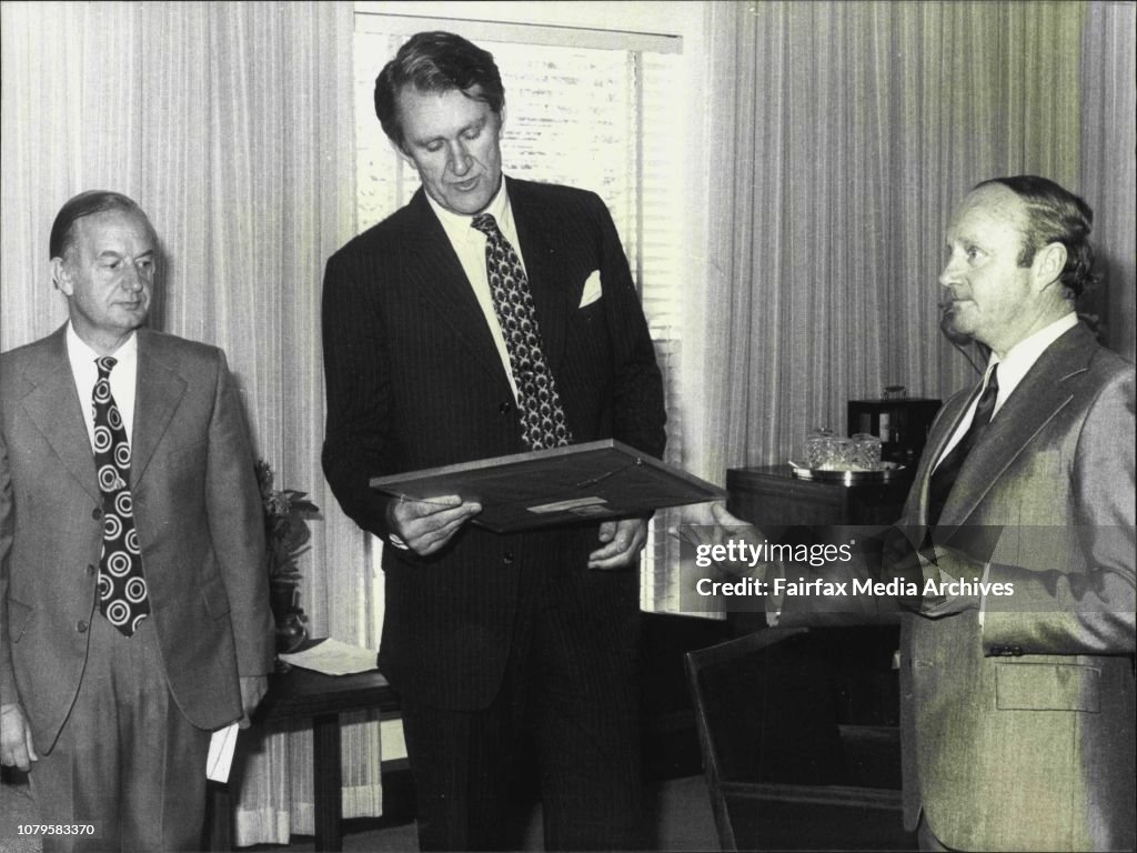 On the left is Professor J.D. Ovington, Director of Australian National Parks and Wildlife Service and right is the Minister for Environment, Senator Newman at the presentation of a Wildlife Painting to the Prime Minister Mr. Fraser. Pic taken at his offi