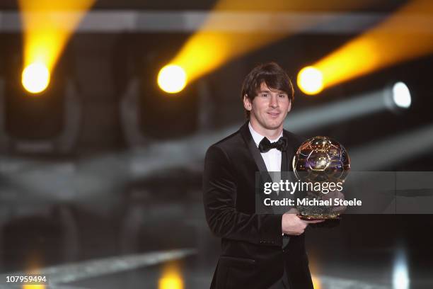 Lionel Messi of Argentina and Barcelona FC receives the men's player of the year award during the FIFA Ballon d'or Gala at the Zurich Kongresshaus on...