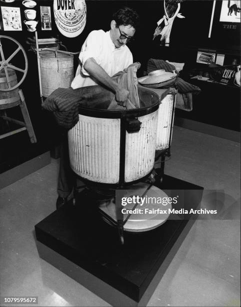 Nicholas Coffill at Elizabeth Bay House with antique washing machine. September 1, 1982. .