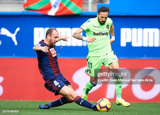 Ivan Ramis of SD Eibar duels for the ball with Jose Luis Morales of Levante UD during the La Liga match between SD Eibar and Levante UD at Ipurua...