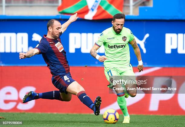 Ivan Ramis of SD Eibar duels for the ball with Jose Luis Morales of Levante UD during the La Liga match between SD Eibar and Levante UD at Ipurua...