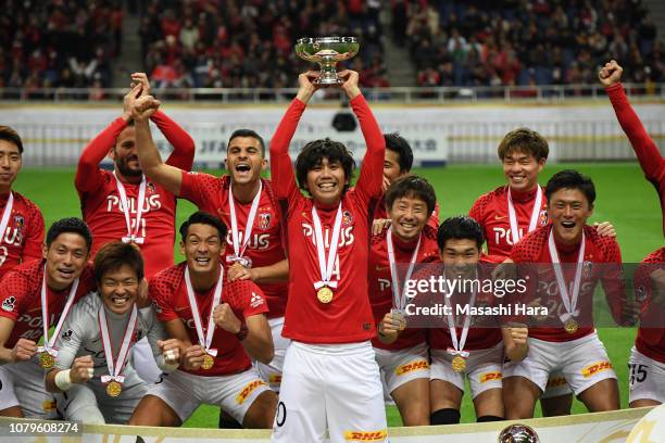 Yosuke Kashiwagi, captain of Urawa Reds lifts the trophy after the 98th Emperor's Cup Final between Urawa Red Diamonds and Vegalta Sendai at Saitama...