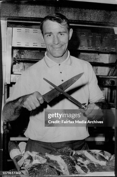 English Capt Frank Myler sharpens his knife to cut into barbecued steaks.Ready to carve 'em up! Frank Myer, chief carver at a team barbecue. June 04,...