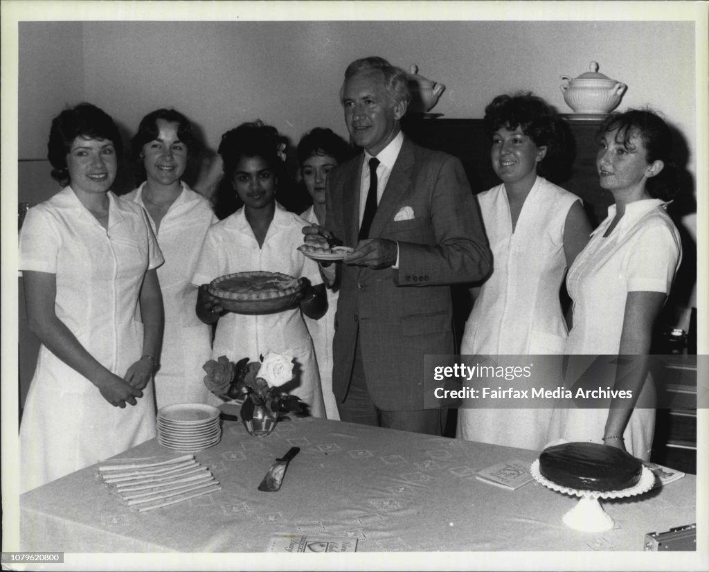 Eliction -- Mr. Peacock tasting his pie as home science students look onLtR) Jennifer Steele, Nth Bondi, Christine Flanagan, Frenches Forrest, Indira Nutta-Singh, Glebe, Helen Williams, Burwood, Mr. Peacock, Sally Holland, Miranda and Paula Dalgleish, Sum