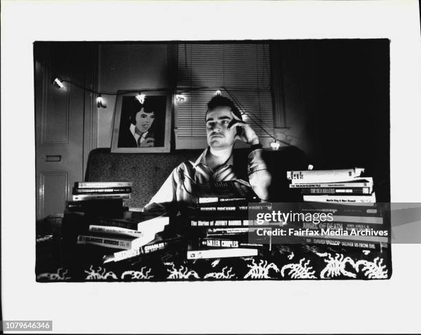 Graeme Beavis - collector of Mass murder paraphernalia with some of his collection of books and a painting of Elvis painted by John Wayne Gacy.Deadly...