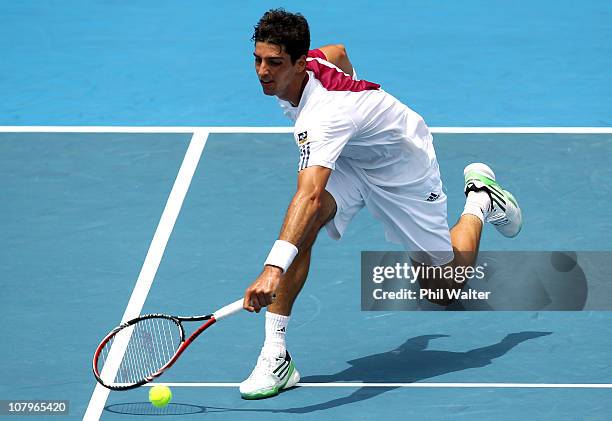 Thomaz Bellucci of Brazil plays a forehand during his match against Michael Russell of the USA on day two of the Heineken Open at ASB Tennis Centre...