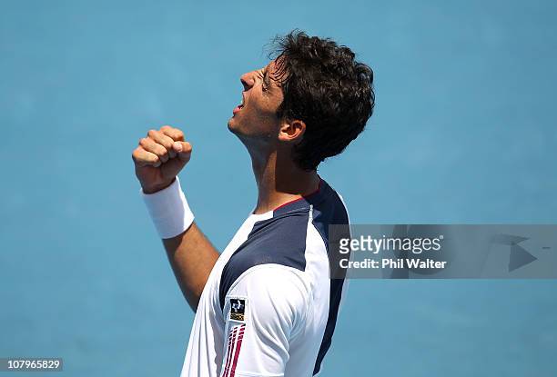 Thomaz Bellucci of Brazil celebrates winning his match against Michael Russell of the USA on day two of the Heineken Open at ASB Tennis Centre on...