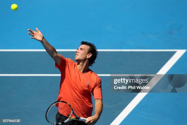 Adrian Mannarino of France serves during his game against Juan Monaco of Argentina on day two of the Heineken Open at ASB Tennis Centre on January...