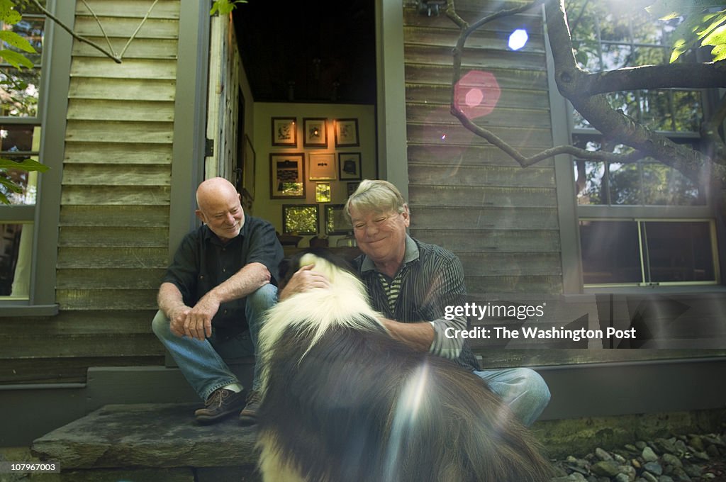 Joe Eck, left, and Wayne Winterrowd, with dog Harry, live at a