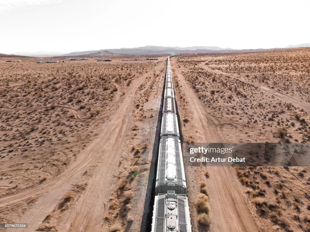 Long freight train in the middle of the desert of California.