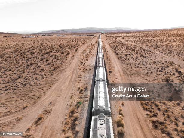 long freight train in the middle of the desert of california. - travel boundless stock pictures, royalty-free photos & images