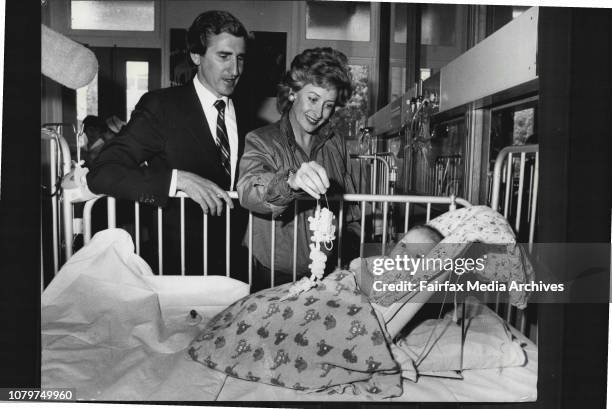 Mr Brereton and his wife, Patricia play with 9 weeks old, Nathan Archer of Padstow.The Minister for Health, Mr Laurie Brereton and his wife Patricia,...