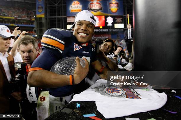 Quarterback Cameron Newton of the Auburn Tigers celebrates the Tigers 22-19 victory against the Oregon Ducks in the Tostitos BCS National...