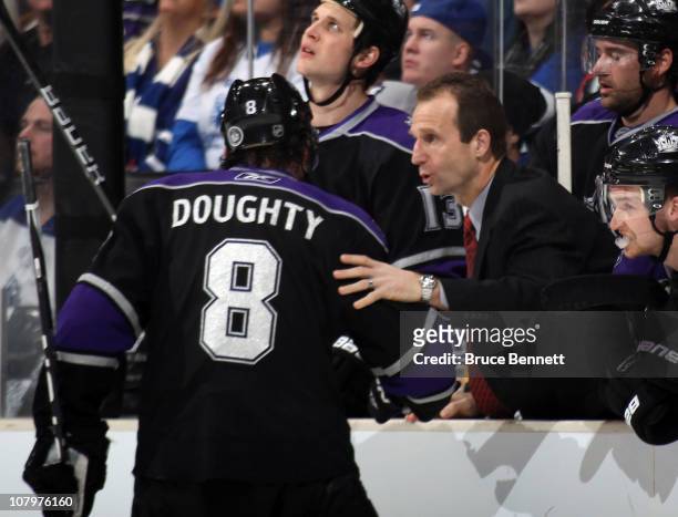 Assistant coach Jamie Kompon gives last minute instructions to Drew Doughty of the Los Angeles Kings in their game against the Toronto Maple Leafs at...