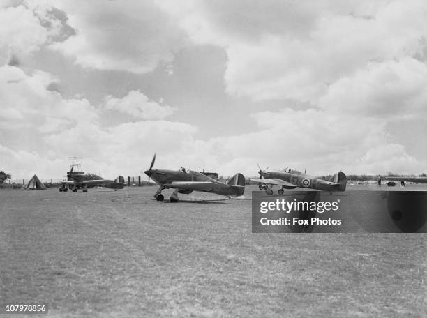 Hawker Hurricanes N2458 and N2459 ready for take-off at Hawkinge Airport in Kent, during World War II, July 1940.