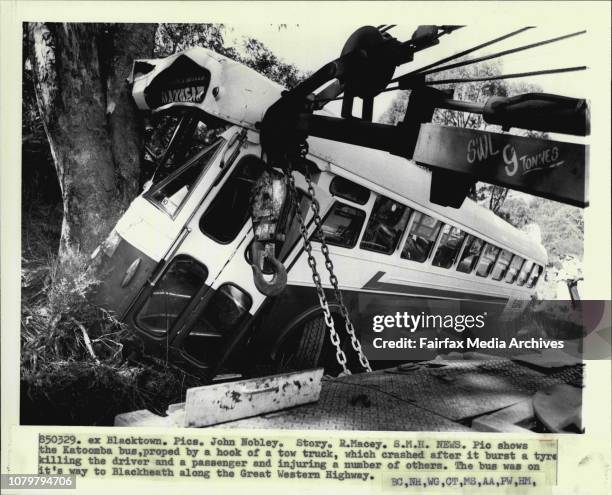 The Katoomba bus, proped by a hook of a tow truck, which crashed after it burst a tyre killing the driver and a passenger and injuring a number of...