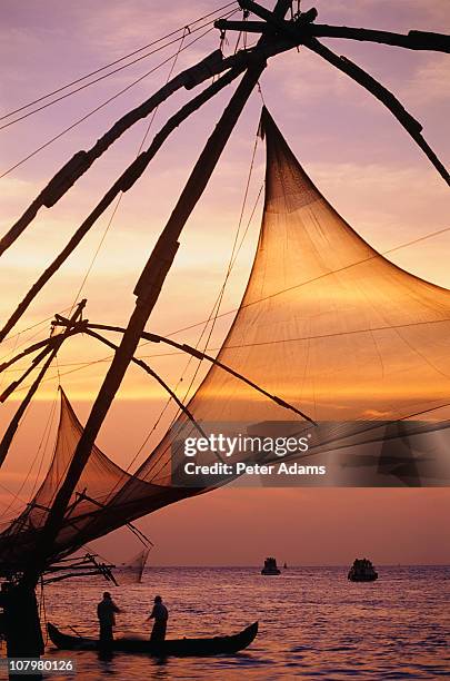 fishing on the waterfront at sunset, kerala, india - cotchin stock-fotos und bilder