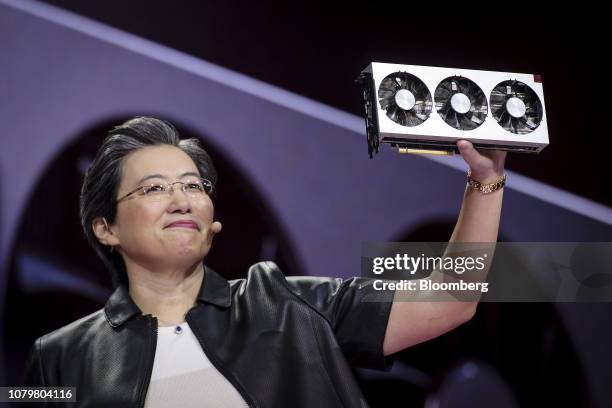 Lisa Su, president and chief executive officer of Advanced Micro Devices , holds a Radeon VII gaming GPU during a keynote session at the 2019...