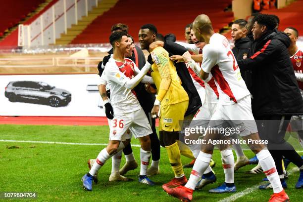 Loic Badiashile of Monaco celebrates the victory with teammates during the French League Cup match between Monaco and Rennes at Stade Louis II on...