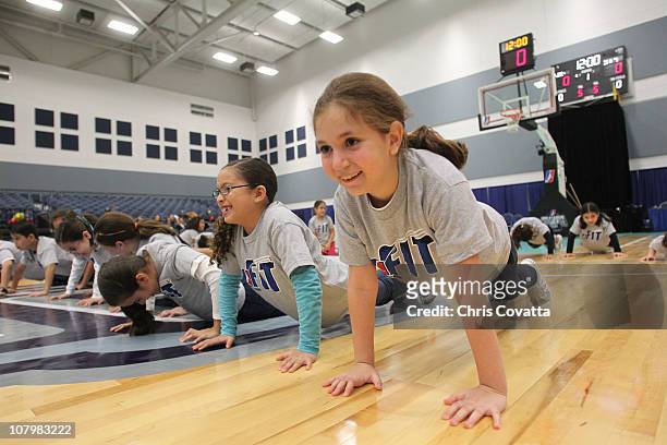Local children participate in the NBA FIT Live Healthy Week during the NBA D-League FIT Clinic during the 2011 NBA D-League Showcase on January 11,...