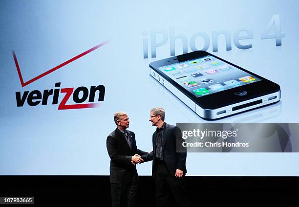 Verizon President and COO Lowell McAdam shakes hands with Apple Chief Operating Officer Tim Cook during the iPhone announcement January 11, 2011 in...