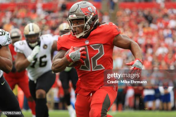 Jacquizz Rodgers of the Tampa Bay Buccaneers runs during the third down against the New Orleans Saints at Raymond James Stadium on December 09, 2018...