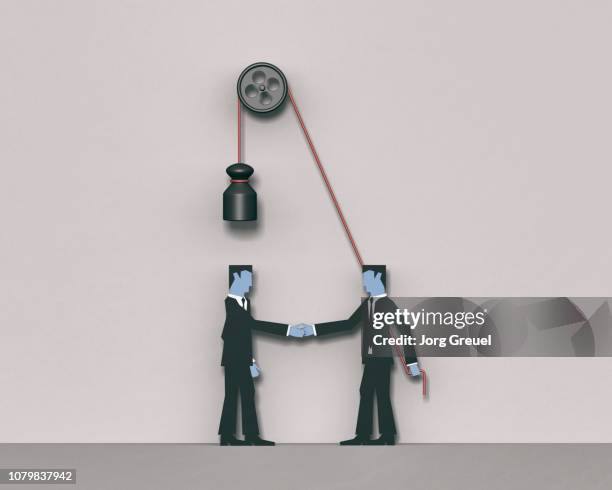 two businessmen shaking hands - hypocrisy stock pictures, royalty-free photos & images