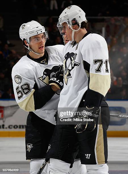 Kris Letang and Evgeni Malkin of the Pittsburgh Penguins skates against the New York Islanders on December 29, 2010 at Nassau Coliseum in Uniondale,...