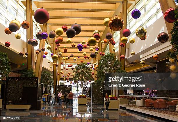 Large colored holiday ornaments hang from the ceiling of the Aria Hotel & Casino lobby in the CityCenter on December 24, 2010 in Las Vegas, Nevada....