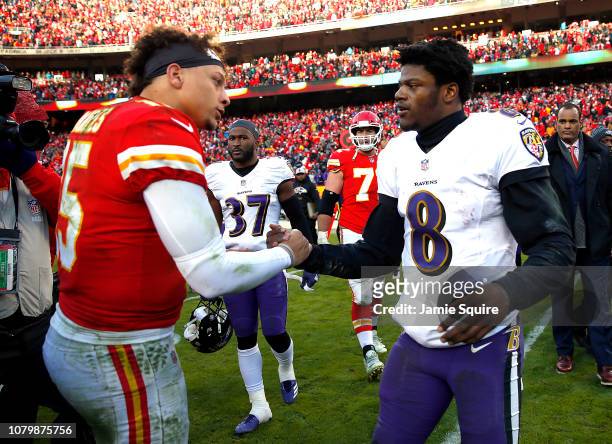 Quarterback Patrick Mahomes of the Kansas City Chiefs shakes hands with quarterback Lamar Jackson of the Baltimore Ravens after the Chiefs defeated...