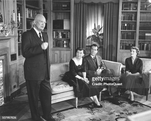 On the eve of the presidential election, sitting President Dwight Eisenhower delivers a television message, watched by his wife, First Lady Mamie...
